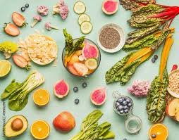 Colorful healthy foods for a liver cleanse: citrus, grapefruit, greens and seeds
